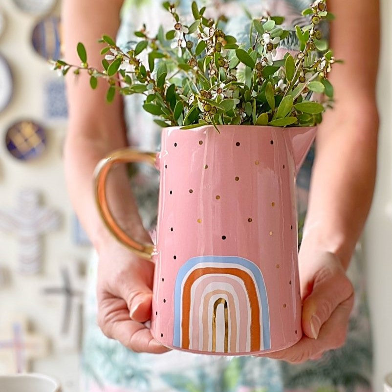 Pretty pink decorative jug with rainbow, gold polka dots and gold handle.