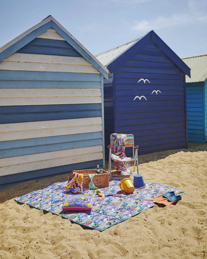 beach huts with Barrier Reef Picnic Mat by Kip & Co x Ken Done at Ruby's Home Store