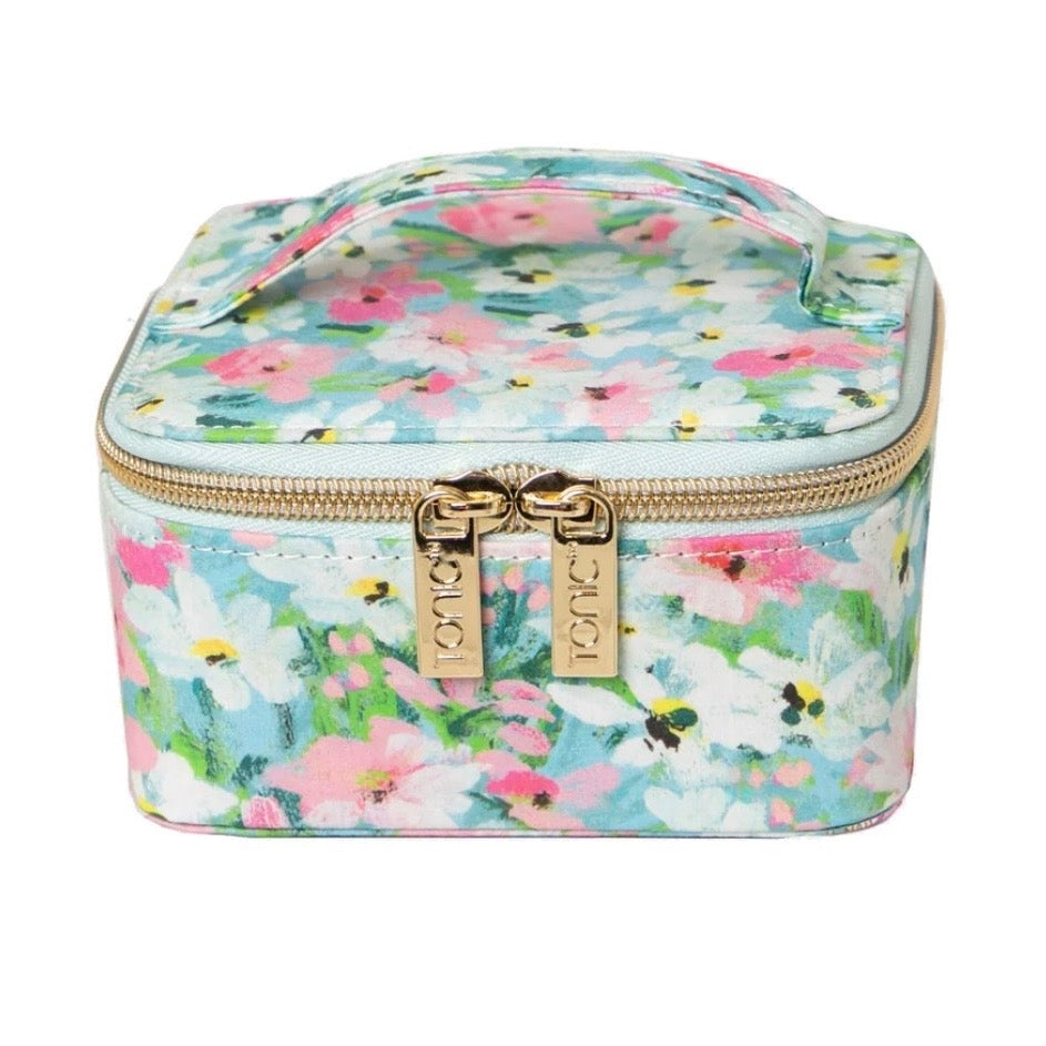 A square cosmetic pouch with a colorful floral print on a light blue background, featuring a top handle, gold zipper, and gold-tone KIKO brand hardware.