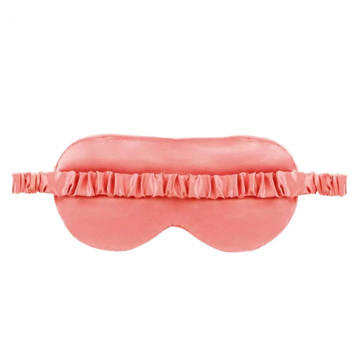 A pink satin sleep mask with a matching ruffled elastic band, shown against a plain white background.