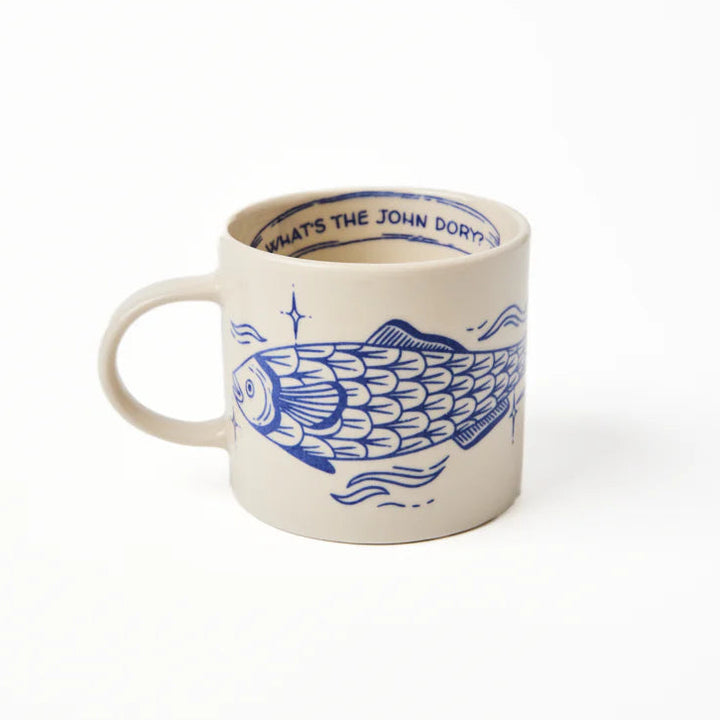 Mug with blue fish design and text on a white background
