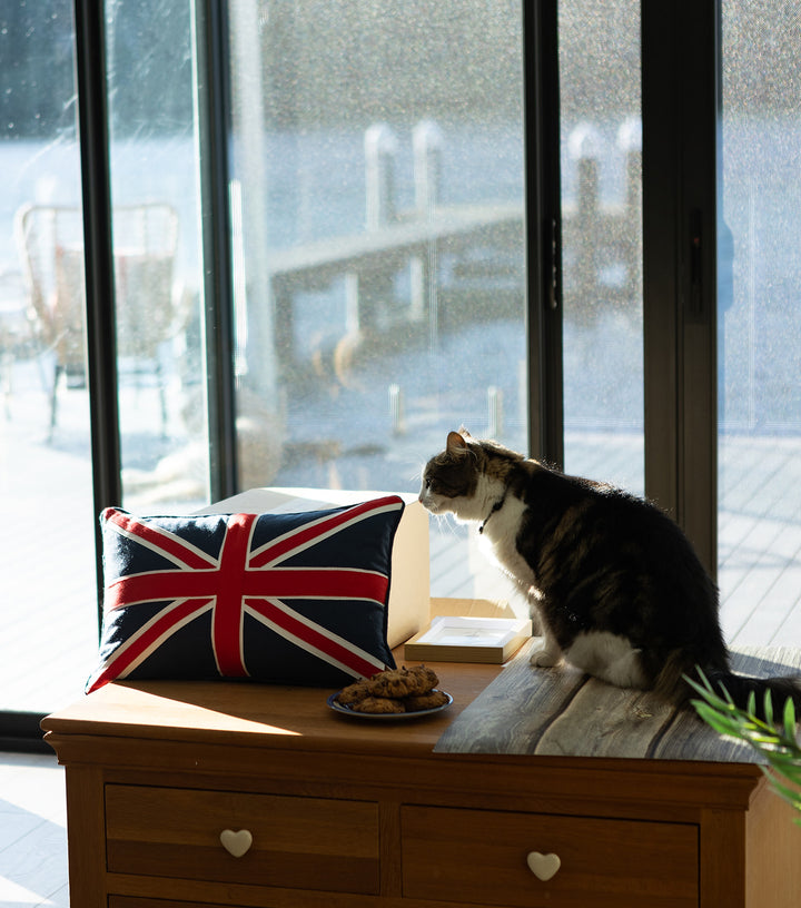 Union Jack cushion on table with cat - Ruby's Home Store